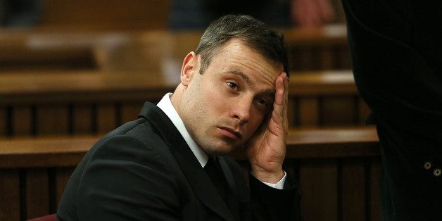 Oscar Pistorius, gestures,  at the end of the fourth day of  sentencing proceedings in the high court in Pretoria,  South Africa, Thursday, Oct. 16, 2014. Following the testimony hearing, which is expected to end this week, Judge Thokozile Masipa will rule on what punishment Pistorius must serve after convicting him of culpable homicide for shooting his girlfriend Reeva Steenkamp through a toilet door in his home.(AP Photo/Alon Skuy, Pool)