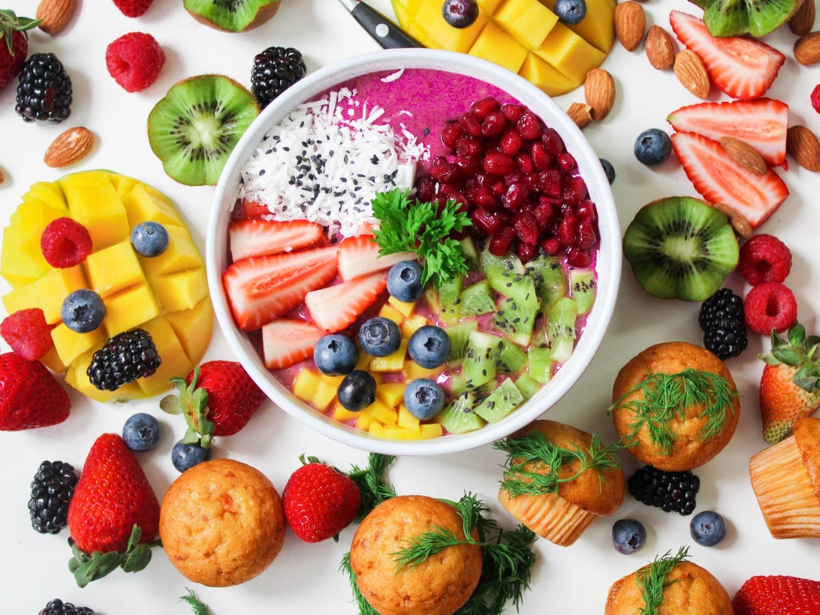 assorted-sliced-fruits-in-white-ceramic-bowl-1092730