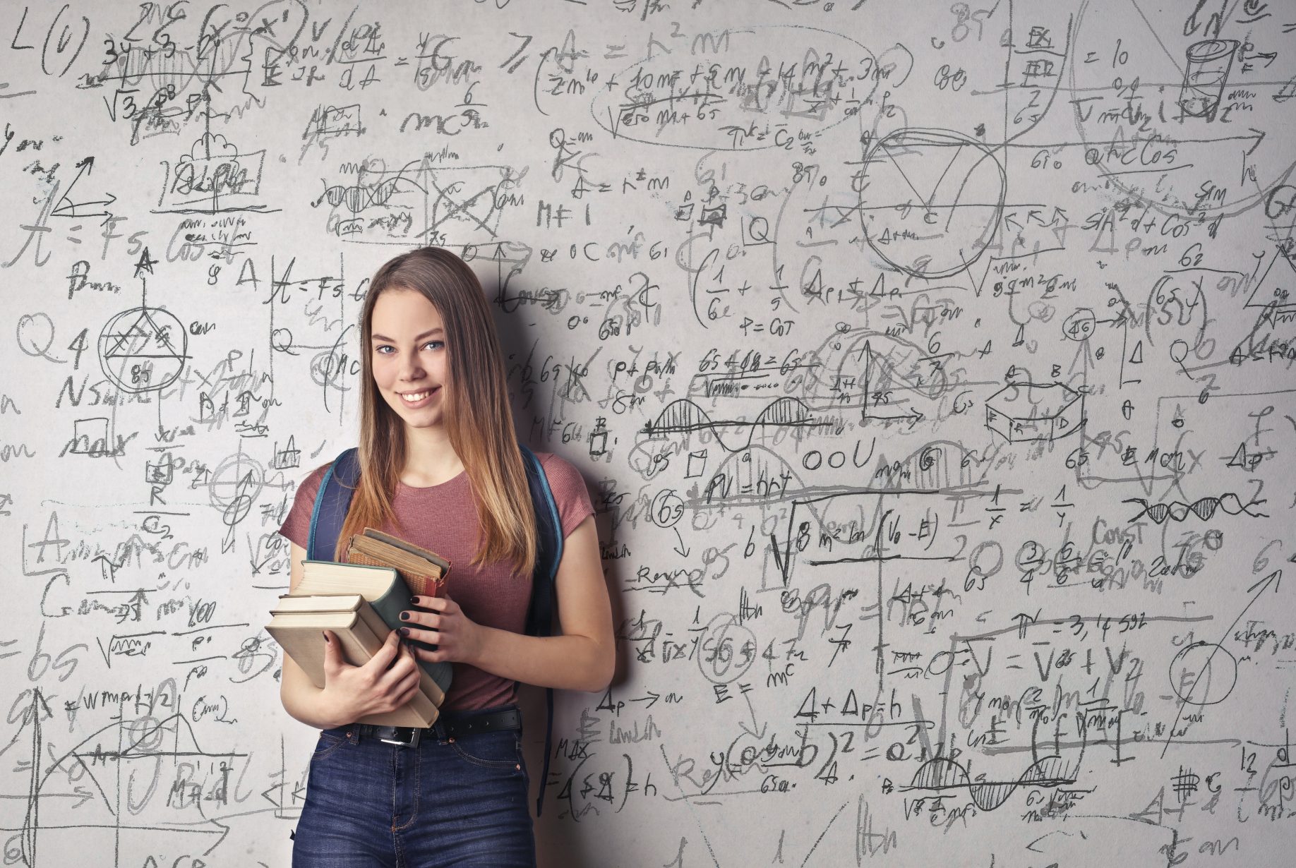 woman-holding-books-3768126