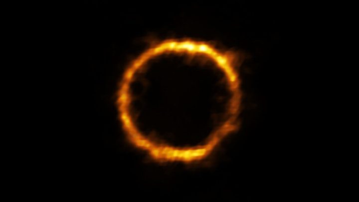 Astronomers using ALMA, in which the ESO is a partner, have revealed an extremely distant galaxy that looks surprisingly like our Milky Way. The galaxy, SPT0418-47, is gravitationally lensed by a nearby galaxy, appearing in the sky as a near-perfect ring of light.